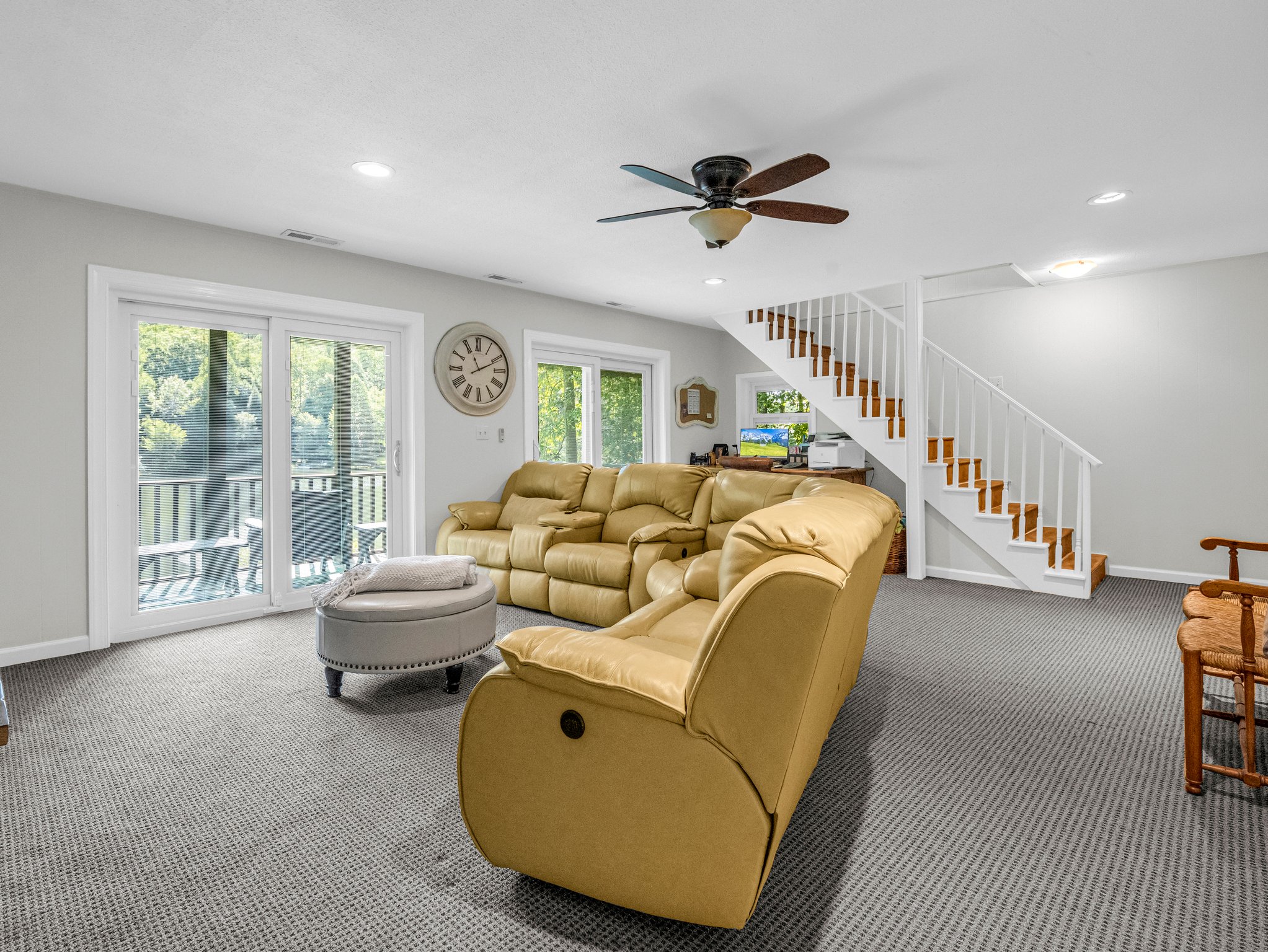 Family room in the finished basement overlooks the lake.