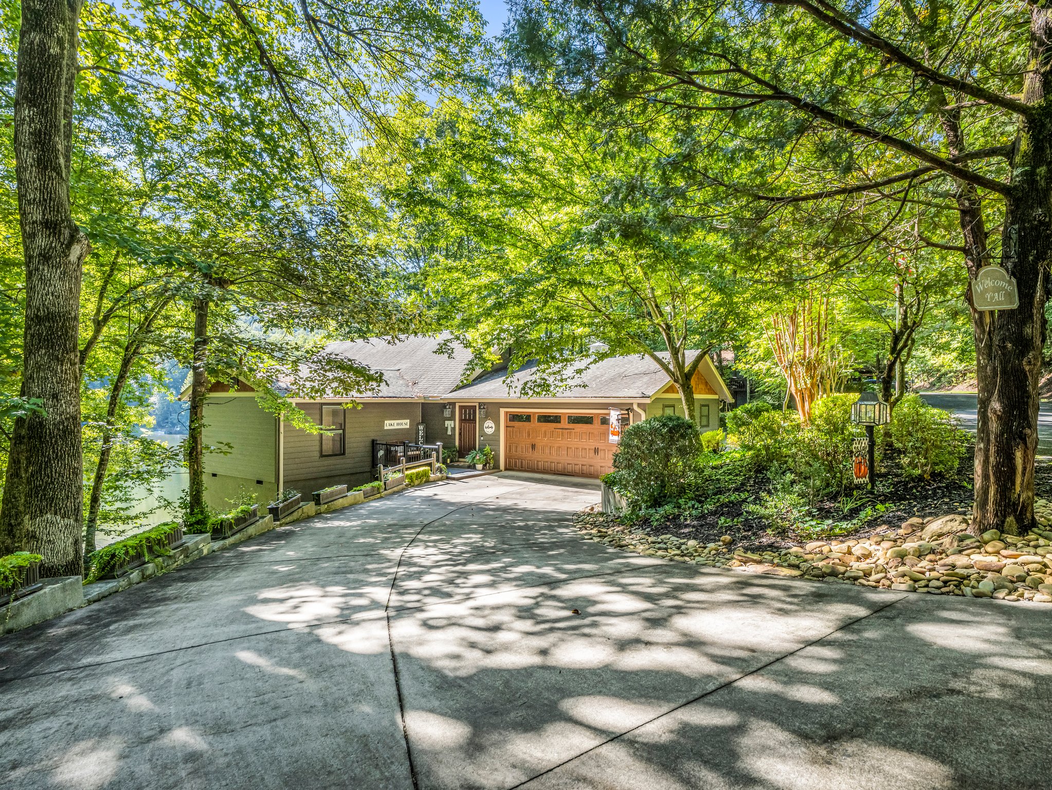 Circular drive with drive-through garage offers easy 1-step level-access into the home.