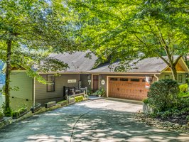 One of two garage door entries into the drive-through garage offers level, easy access into the lakefront home.