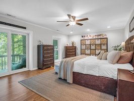 Guest bonus room in the lower-level finished basement offers views of the lake & access to the back deck.