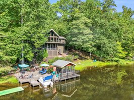 The dock area and lake are easily accessible from the home with minimal steps. Gently sloping back yard with a fenced-in area offers room for pets. A perfect shoreline experience for fishing, reading, or simply lounging.