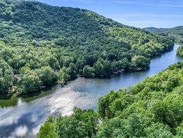 Truly the best of both worlds, enjoy the peaceful setting on Bald Mountain Lake from within the gates of Rumbling Bald on Lake Lure, and also have access to Lake Lure.