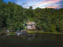 A rare find in Lake Lure - Lakefront home situated on a double lot on Bald Mountain Lake, behind the gates in Rumbling Bald on Lake Lure. Walking distance to hiking trails, convenient access to all resort amenities and both Bald Mountain Lake and Lake Lure. Truly the best of both worlds!