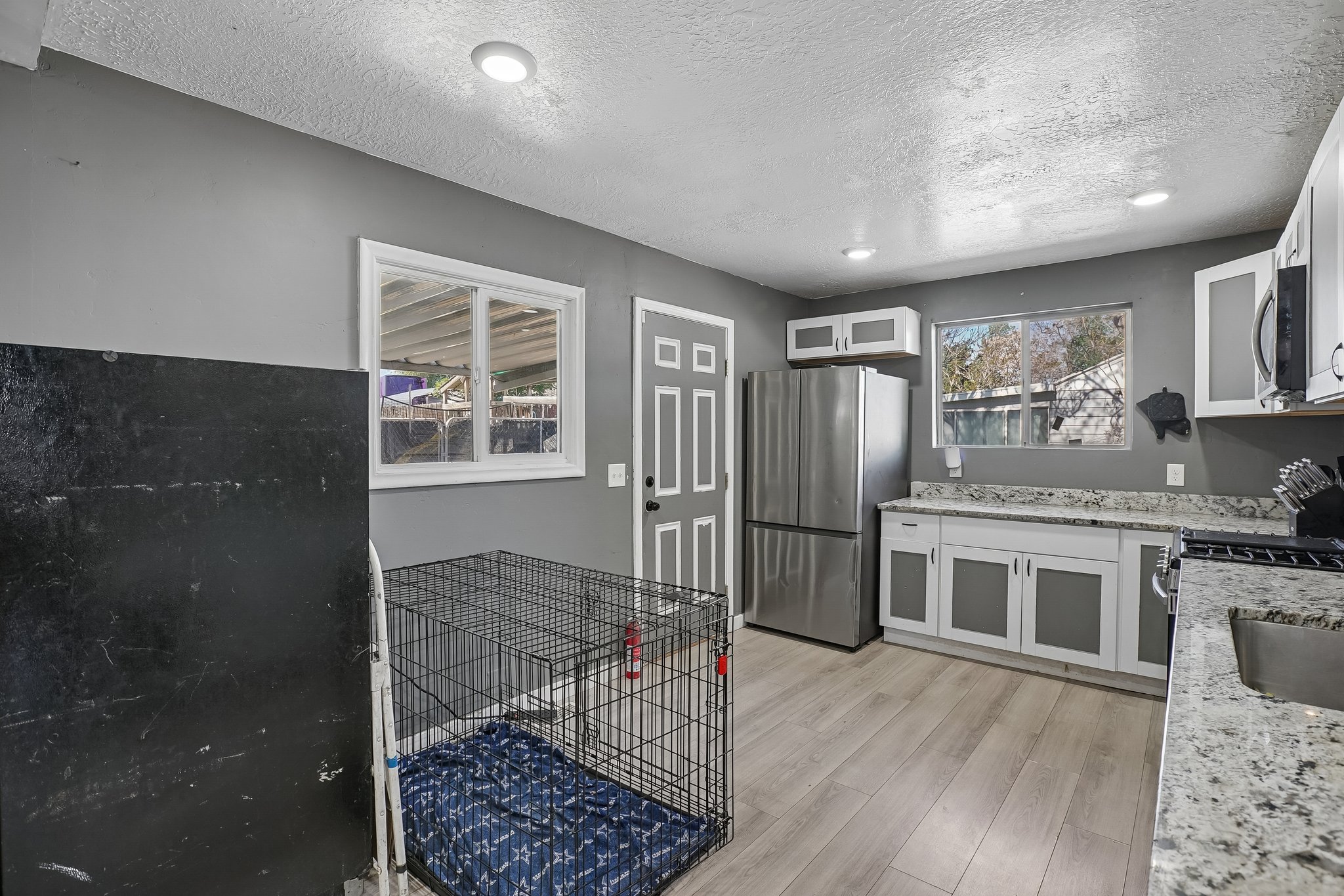 Kitchen w/Door to Back Patio.jpg
