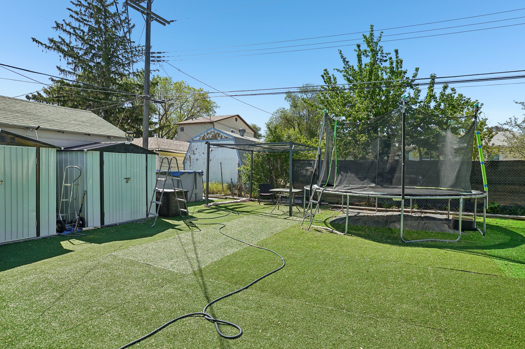 2 Storage Sheds & Trampoline.jpg