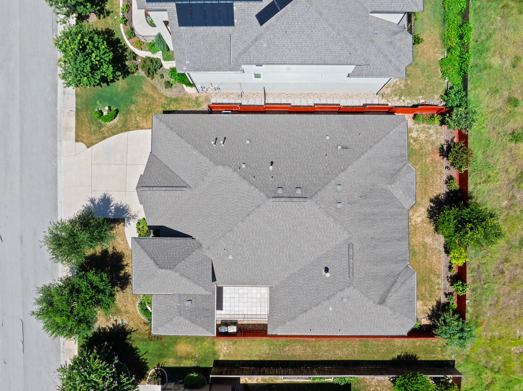 The home backs to an open green space.