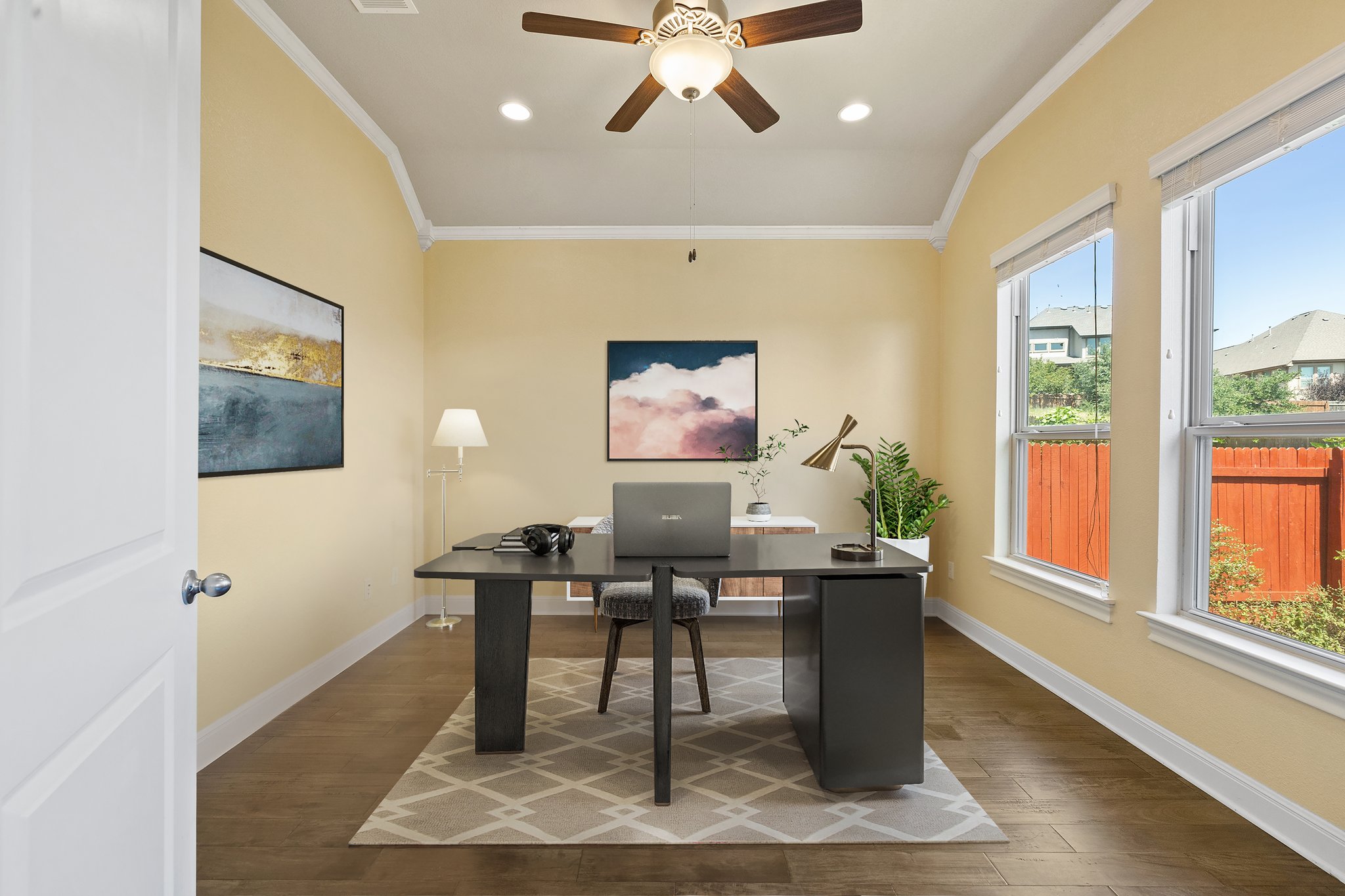 The room near the breakfast area can be a second study or another living area. Virtually staged.