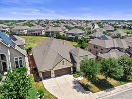 The home backs to an open green space.