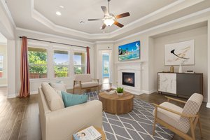 Lots of natural light, fireplace, TV nook. Virtually staged.