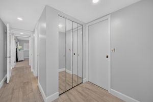 Hallway to primary bed and bath