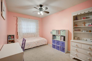 Adorable bedroom 2 with a window facing the side yard.