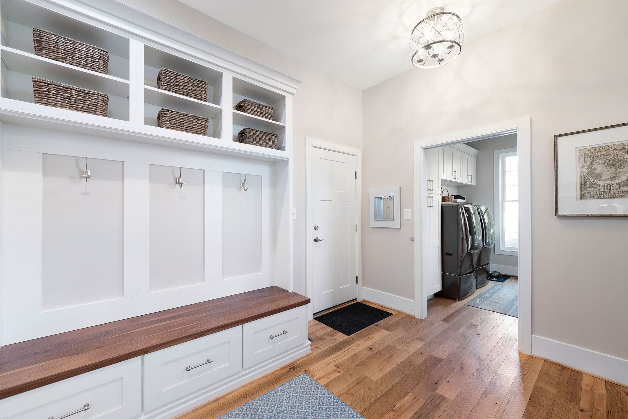 The mud room has been redesigned for a sleek, organized storage area
