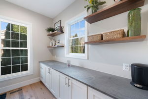 The laundry room features  soapstone counters