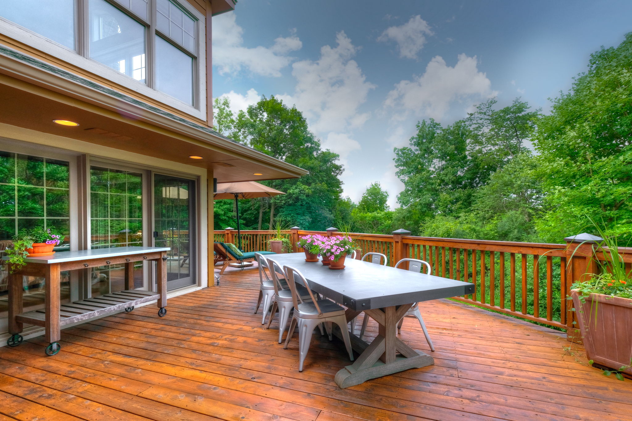 Spacious deck complete with wood burning fireplace and gas grill