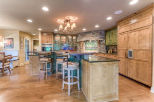 Gourmet chef's kitchen features Wolf appliances, honed granite counters, knotty alder cabinets & separate butler's pantry