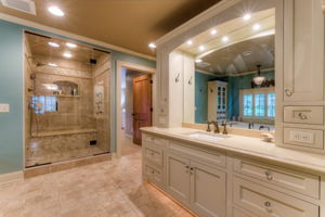 Spa-like master bathroom complete with heated limestone floors and steam shower