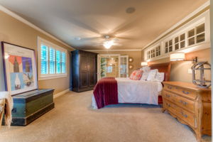 Master bedroom has sitting area, large walk-in closet, private bath, & exercise room
