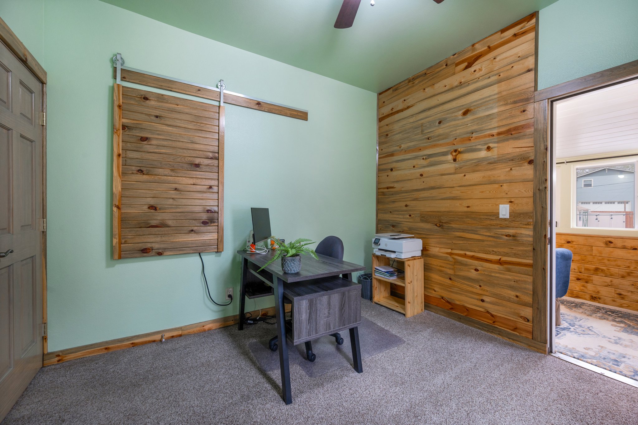 Bedroom 2 with hidden shelves behind bar door