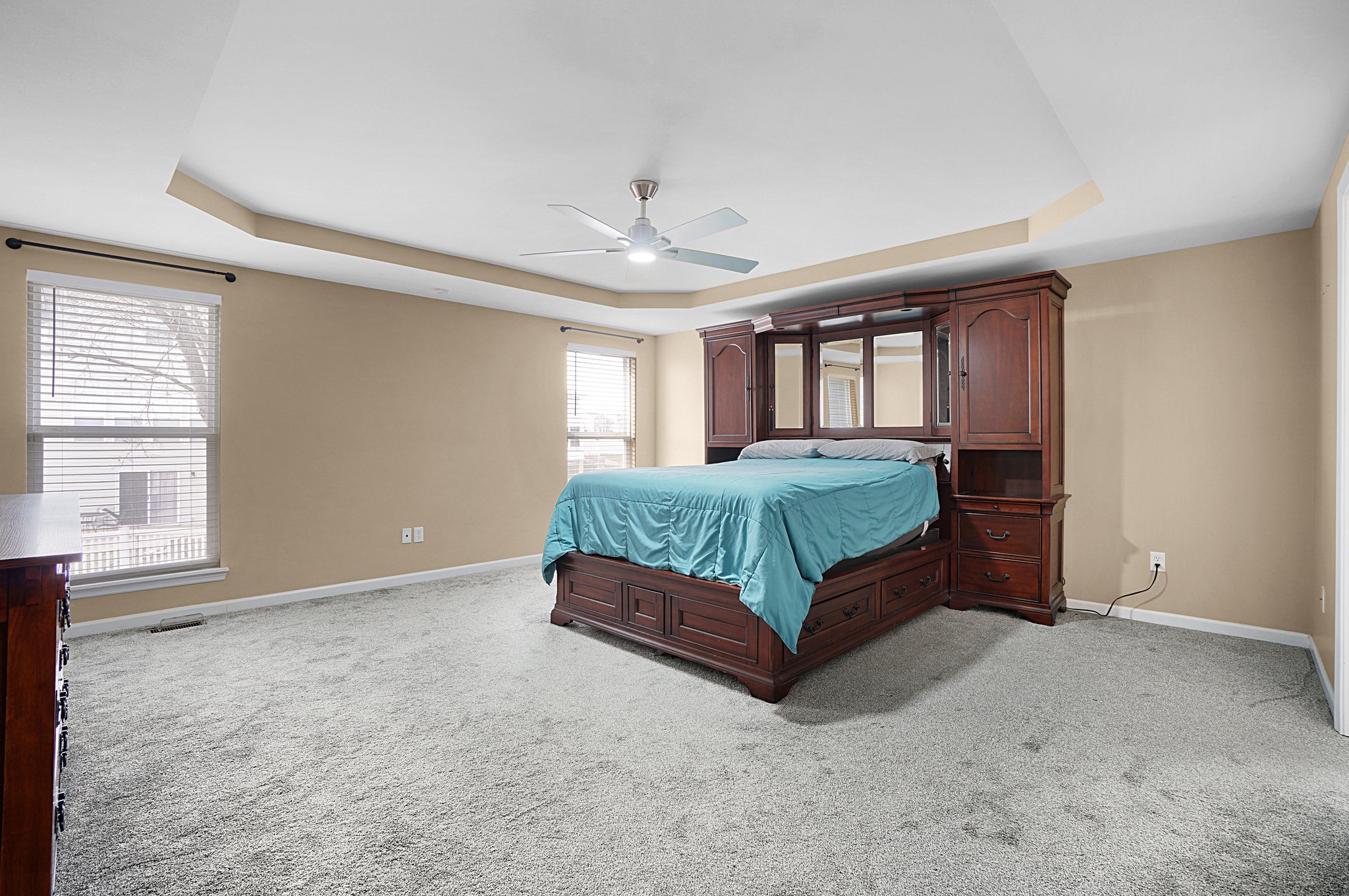 Huge primary bedroom with tray ceilings