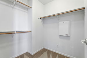 Walk in closet in primary room