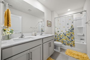 Full Bathroom w/ Double Vanity and Tub