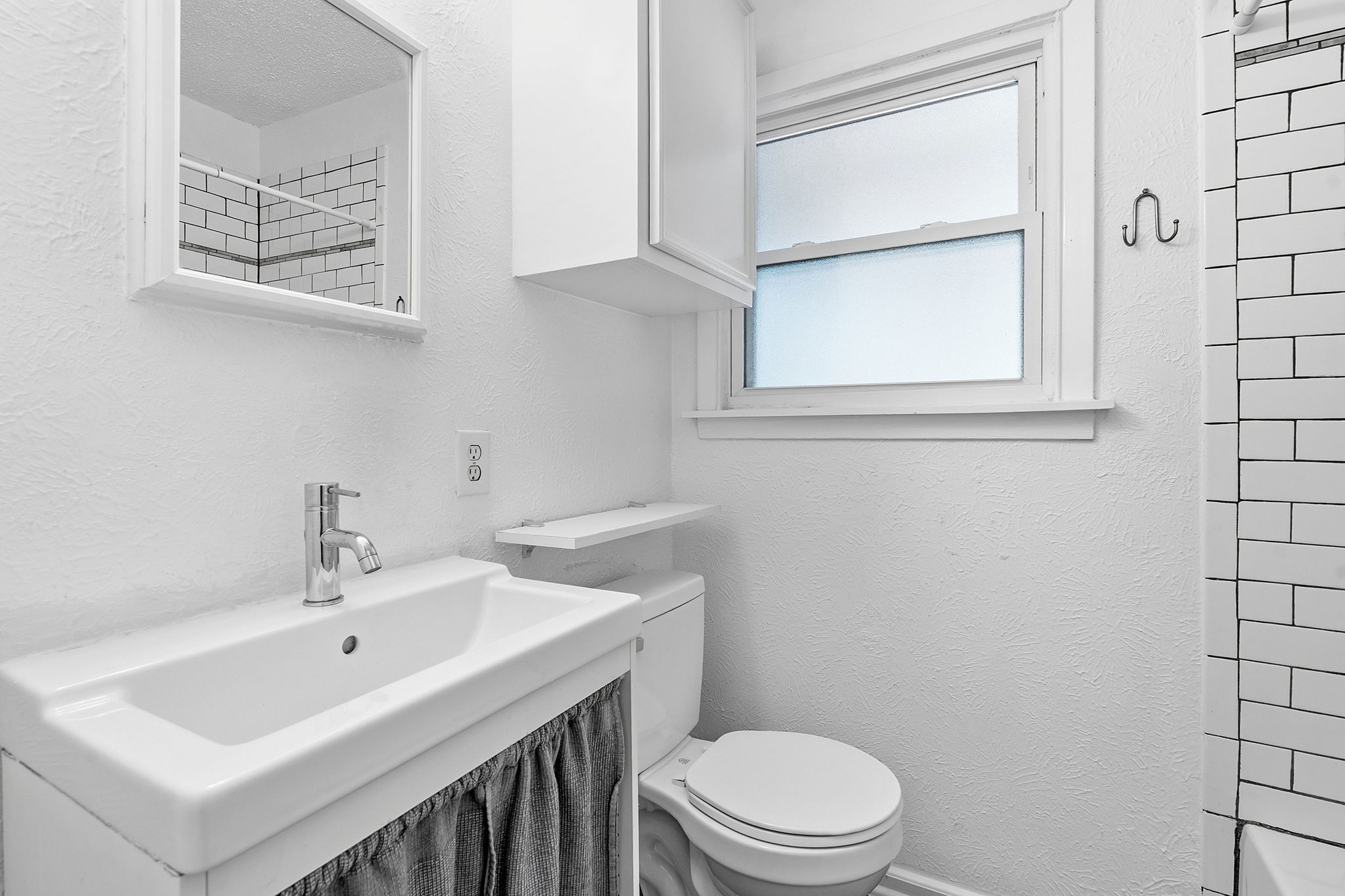 Bathroom (updated, including vanity, toilet, flooring).