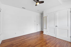Primary bedroom's closet, which is spacious when compared against other 1950s-built closets - it has double doors even!