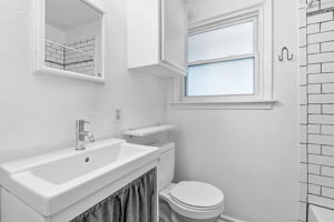 Bathroom (updated, including vanity, toilet, flooring).
