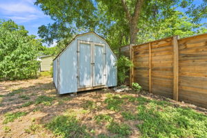 The shed in the far back, northwest corner of the lot.