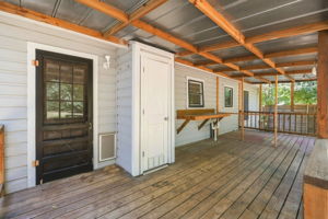 Back porch was added by prior owners.  The closet seen holds the tankless water heater.
