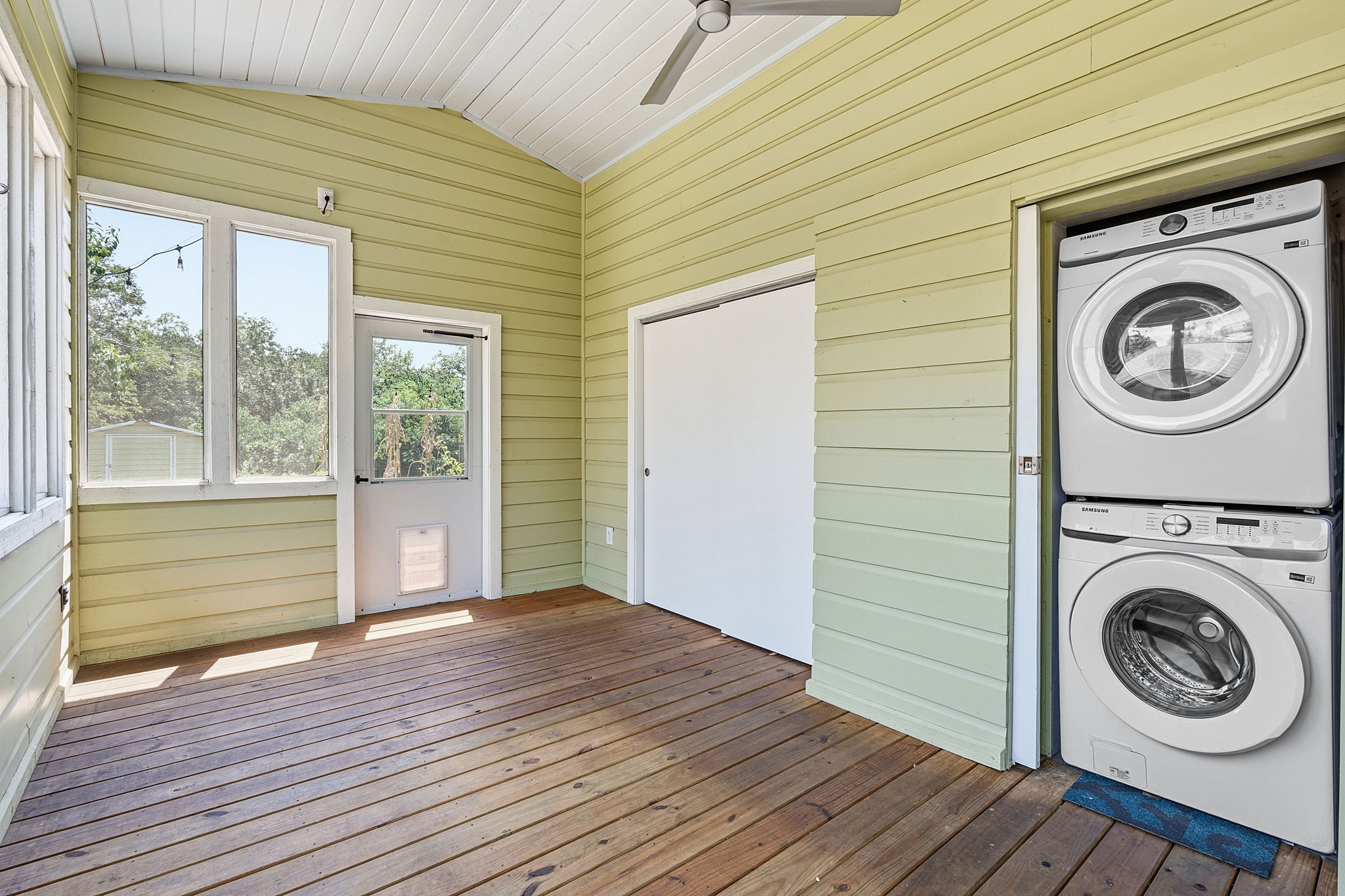 Laundry closet and storage on porch.  The irrigation system control box is in the closet/storage area.