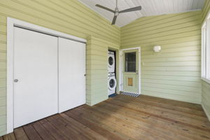 The back porch, with door open to view washer/dryer closet.  Also an extra storage area.  The original 1952 back door through to the kitchen is also in view.