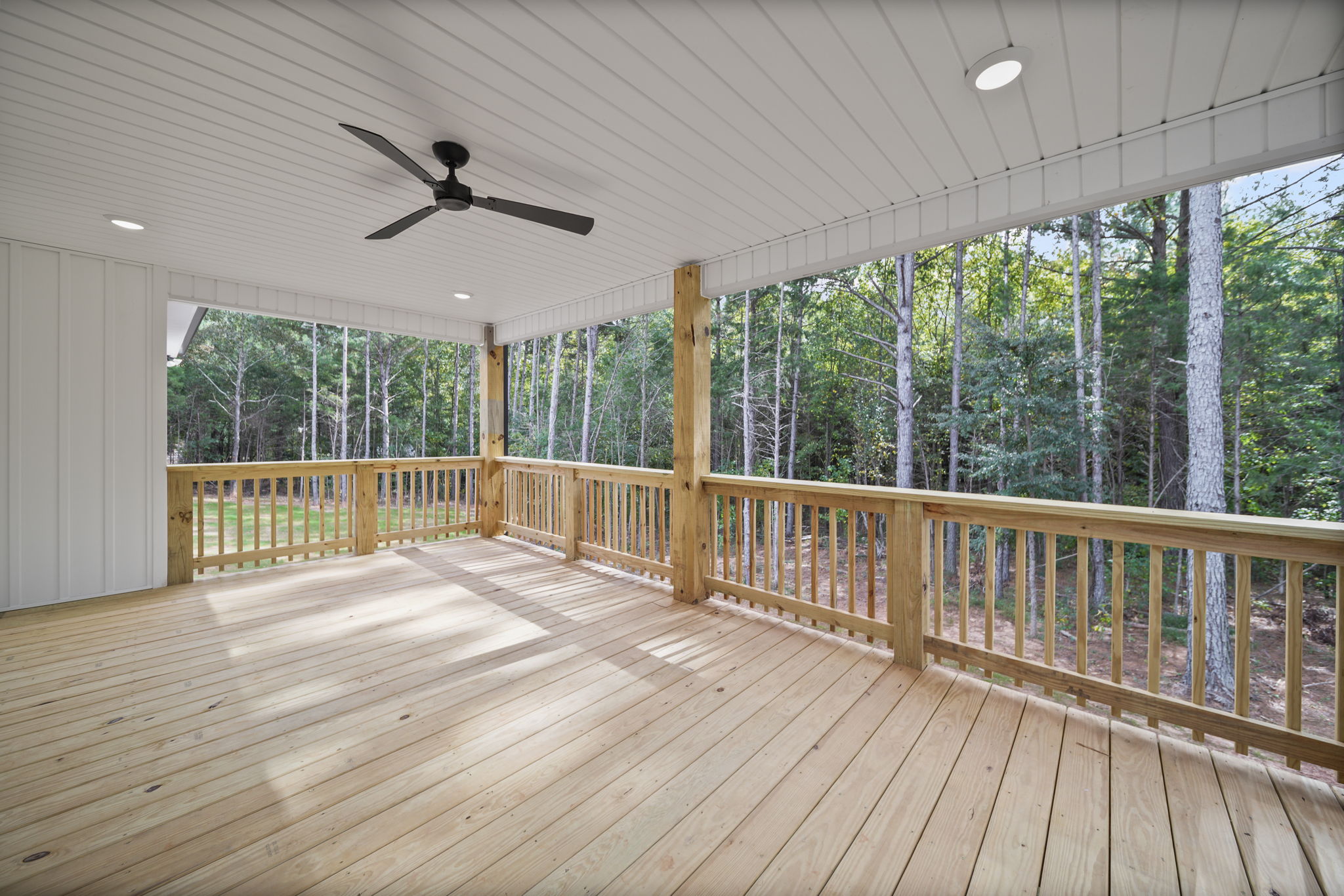 Large covered patio overlooking your private wooded back yard
