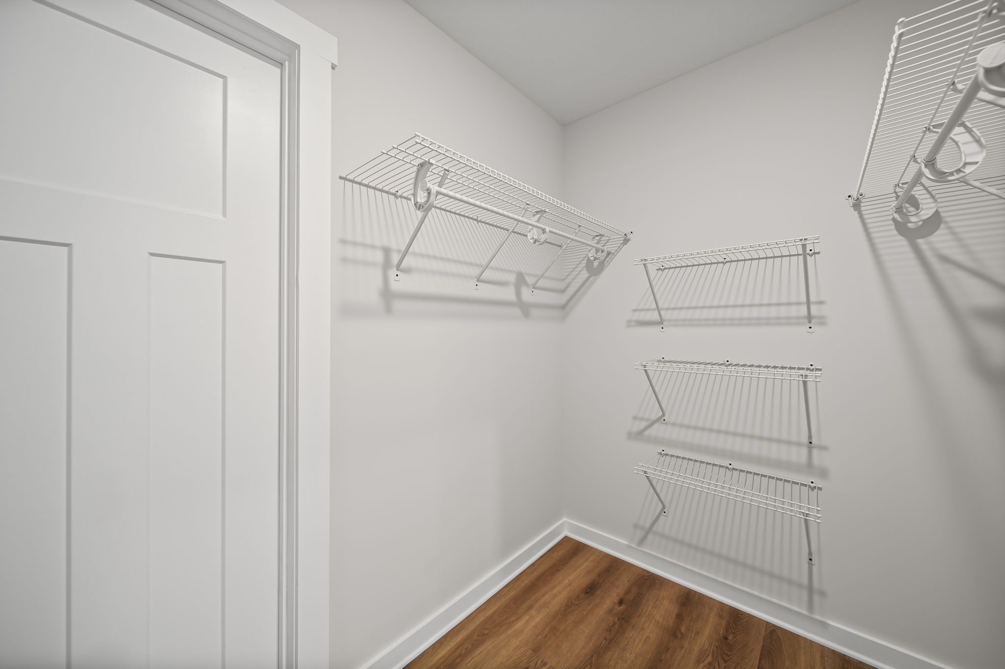 Primary closet w/ solid wire rack shelving
