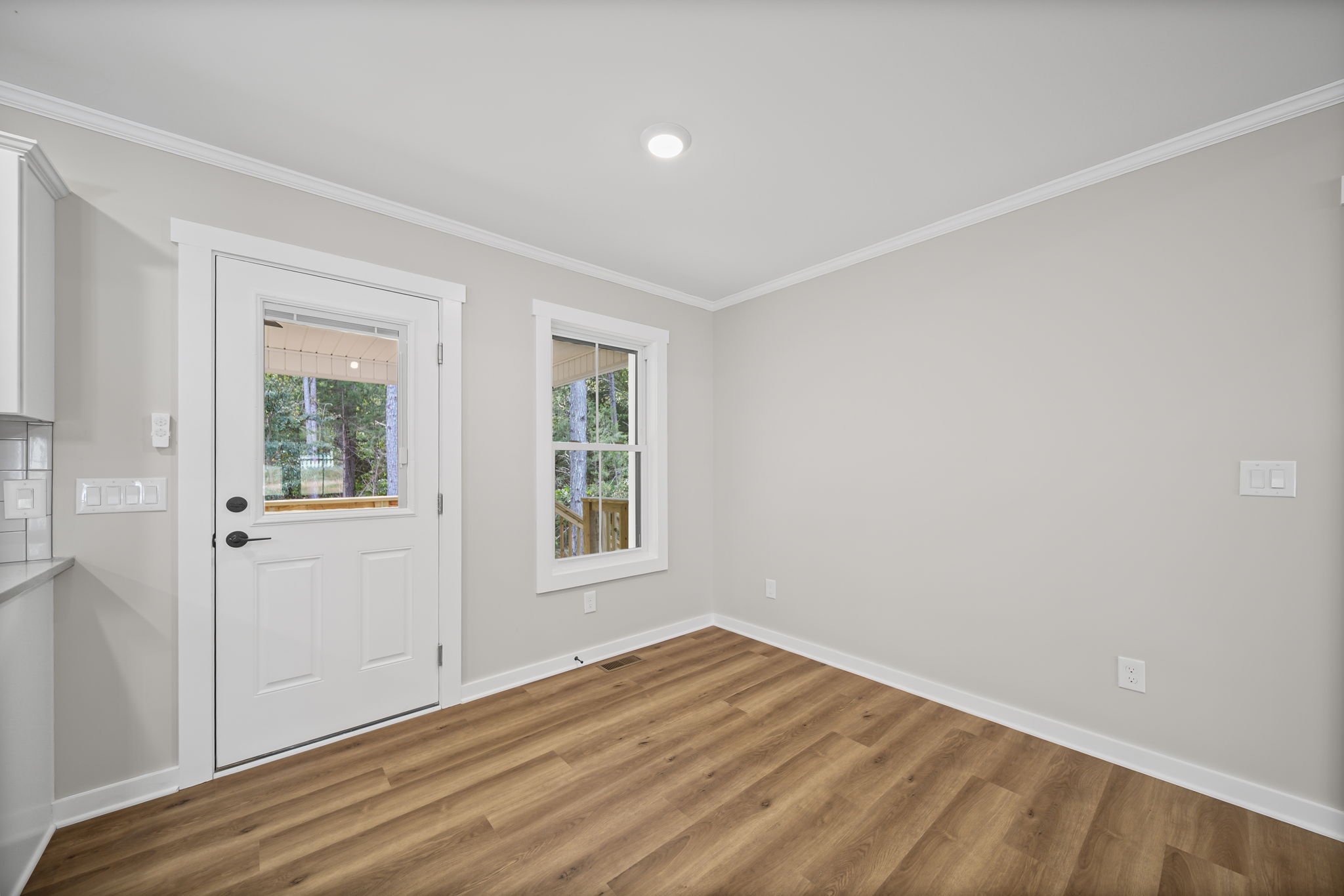 Dining area with exterior door to covered back patio