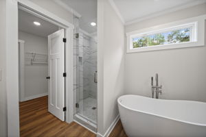 Primary bathroom with soaking tub and separate stand up tiled shower