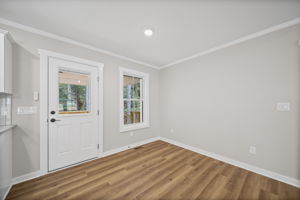 Dining area with exterior door to covered back patio