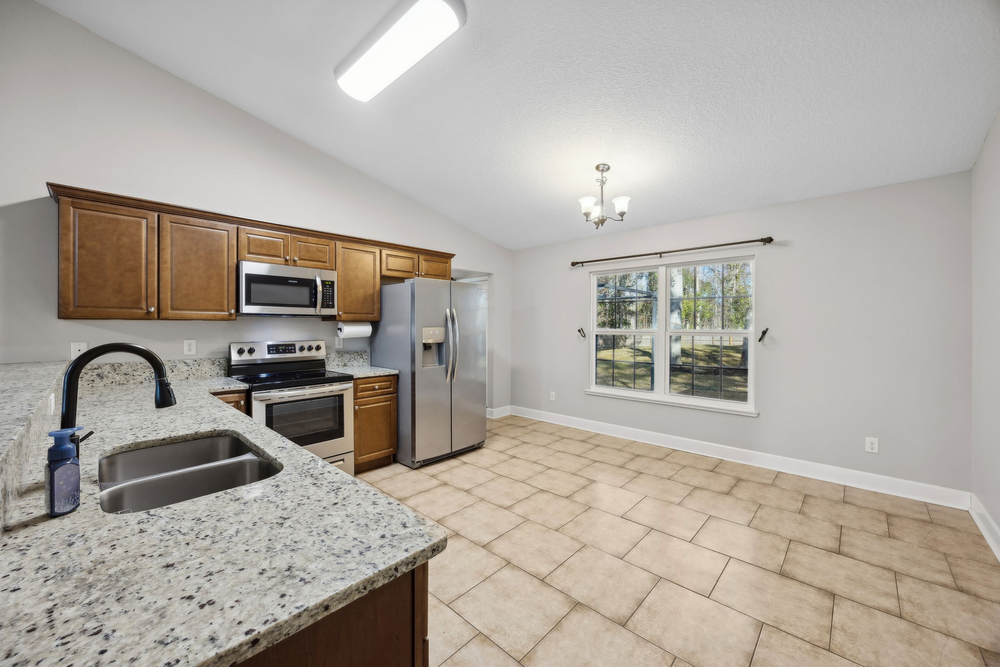 Kitchen with Granite Countertops and Tile Floor