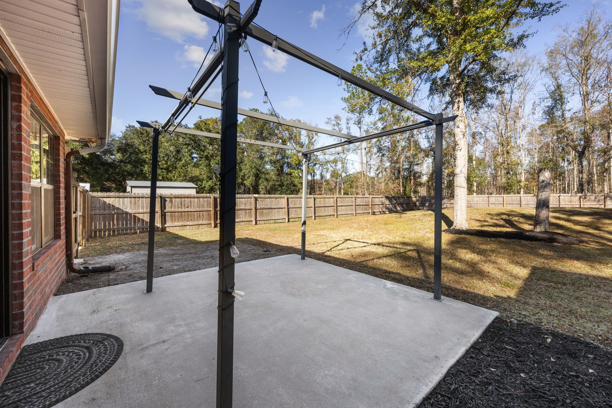 Rear Patio and Large Fenced Backyard
