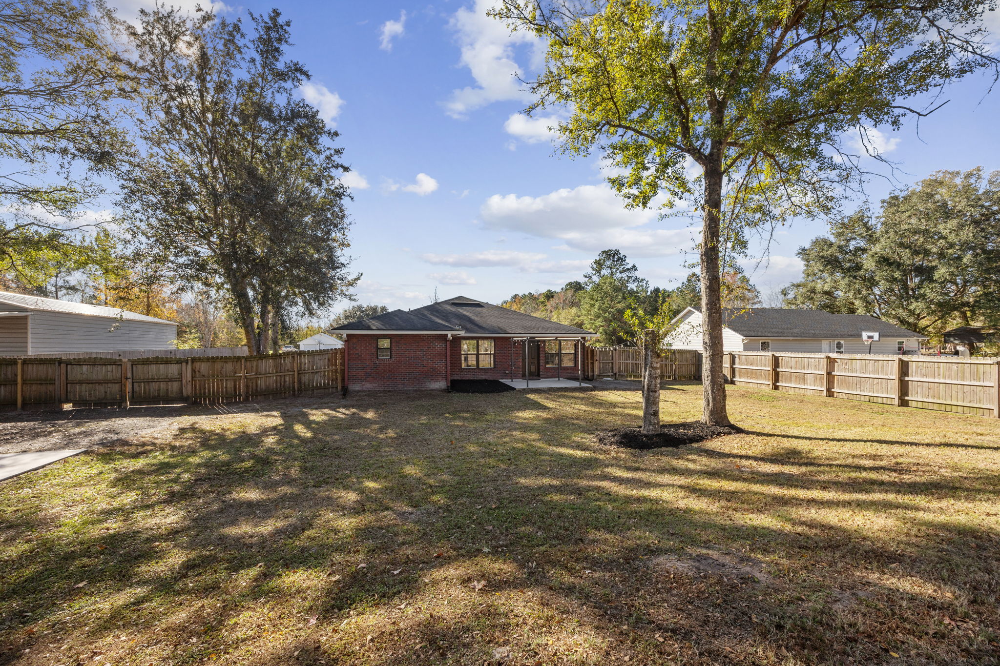 Fully Fenced Backyard with Solar Lights