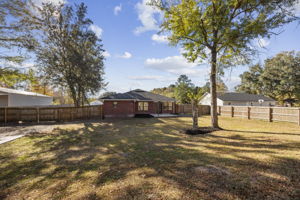 Fully Fenced Backyard with Solar Lights