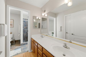Primary Bathroom with Dual Vanities, Walk In Shower.