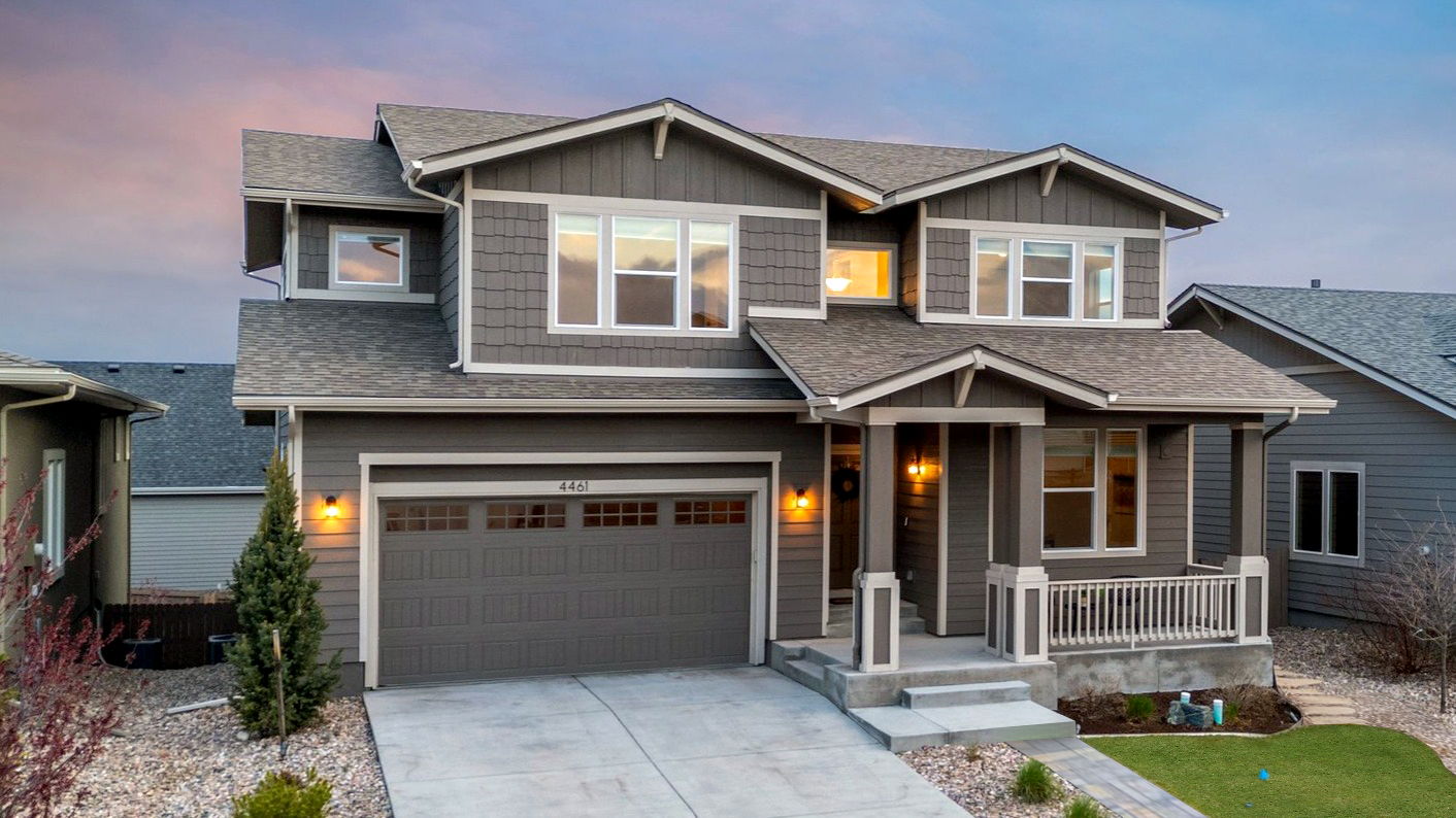 Covered Front Porch and Large 3 Car Tandem Garage