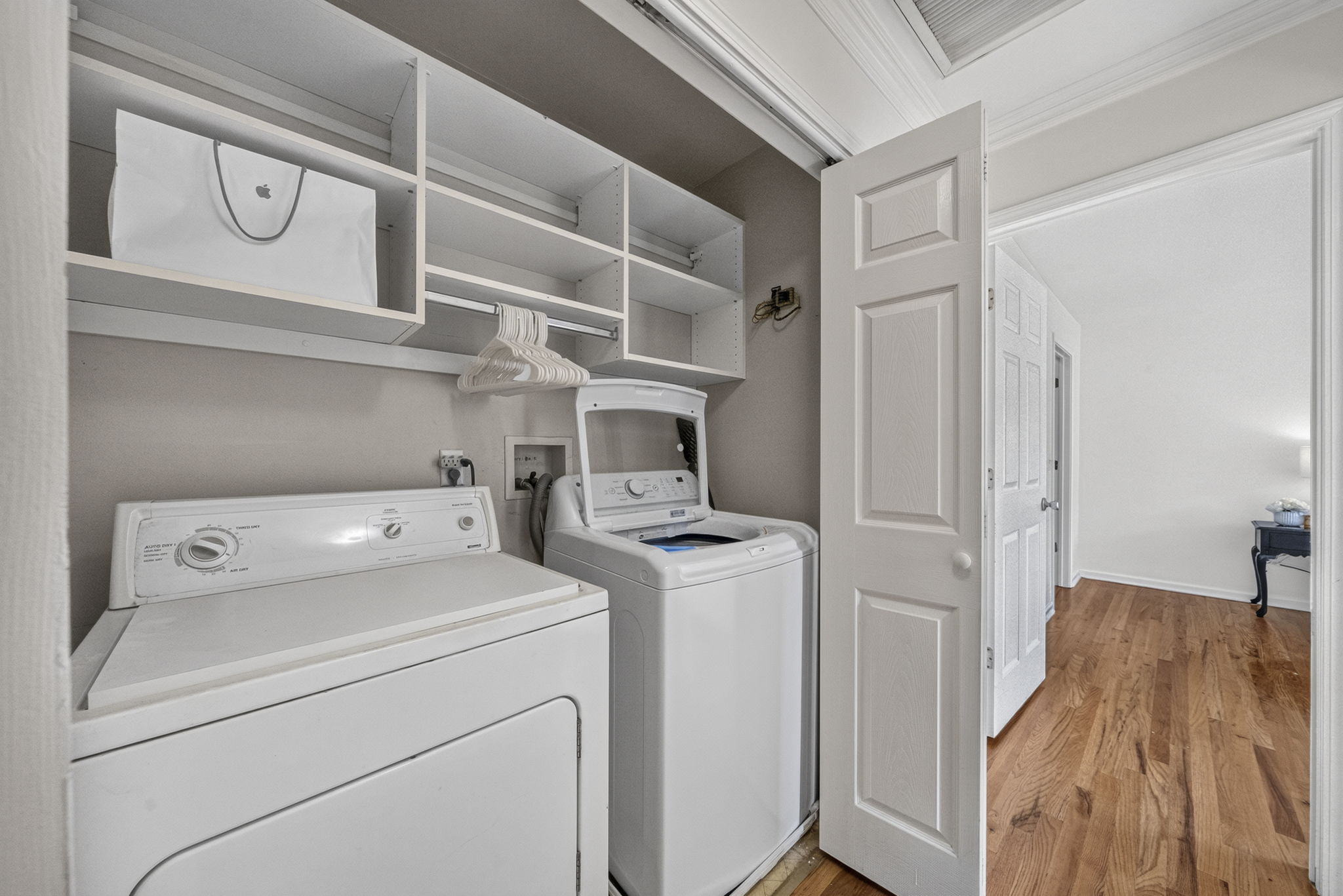 Laundry Room Laundry Are with Built ins for hanging, & storing.  Washer & Dryer Included.