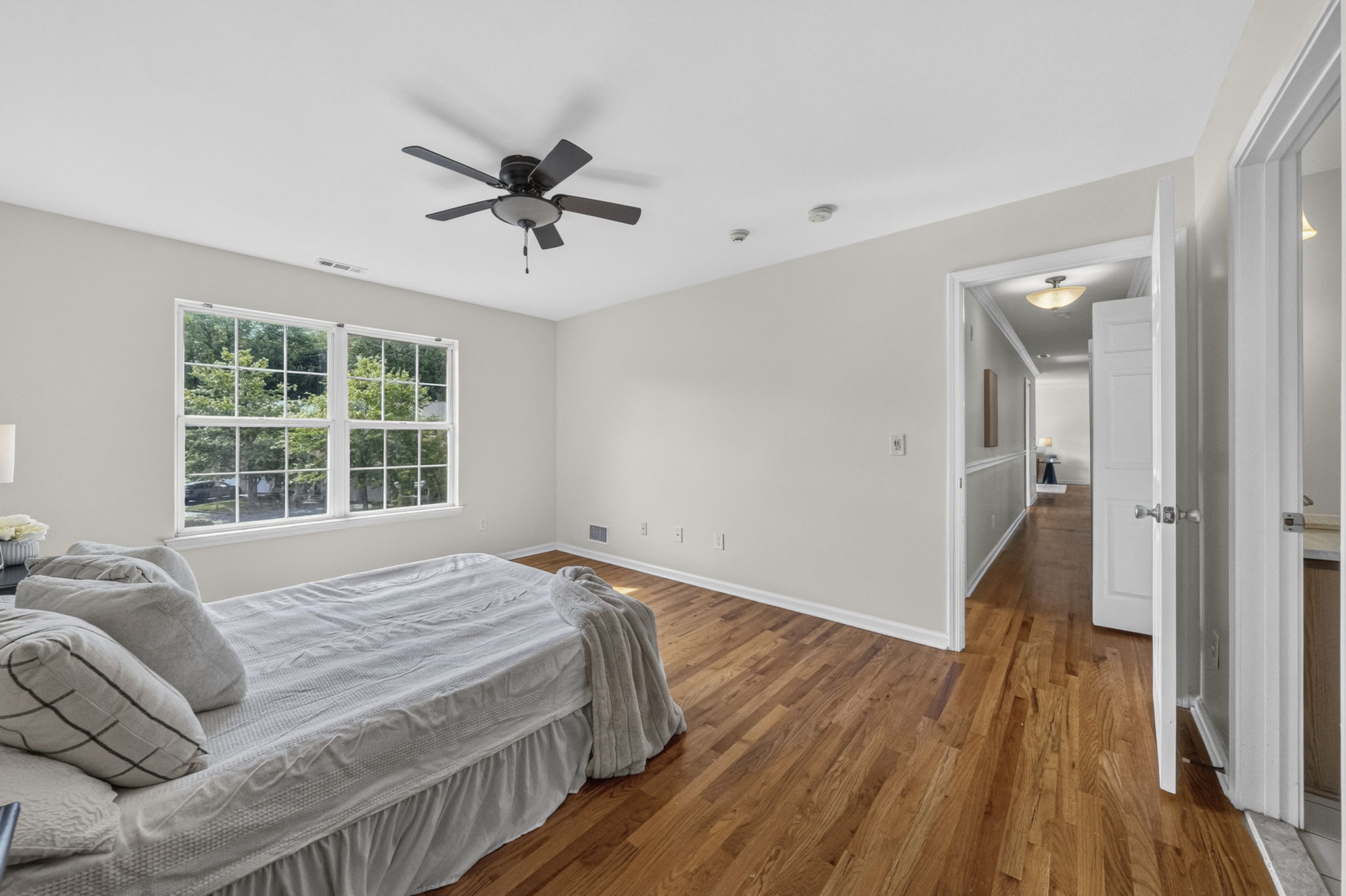Primary Bedroom with walk in closet with built ins, valet, drawers-including a velvet two tier jewelery drawer, private bathroom with shower and attic access from WIC.