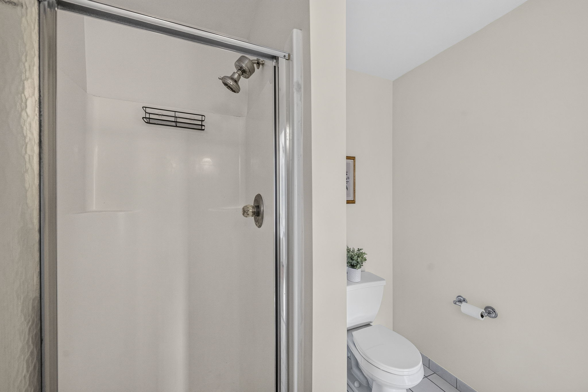 Primary Bedroom with walk in closet with built ins, valet, drawers-including a velvet two tier jewelery drawer, private bathroom with shower and attic access from WIC.