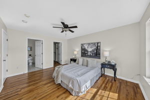 Primary Bedroom with walk in closet with built ins, valet, drawers-including a velvet two tier jewelery drawer, private bathroom with shower and attic access from WIC.