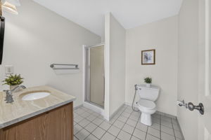 Primary Bedroom with walk in closet with built ins, valet, drawers-including a velvet two tier jewelery drawer, private bathroom with shower and attic access from WIC.