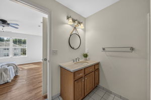 Primary Bedroom with walk in closet with built ins, valet, drawers-including a velvet two tier jewelery drawer, private bathroom with shower and attic access from WIC.