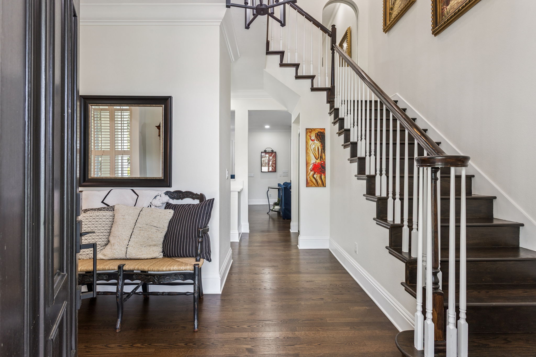 Welcoming, light filled foyer with solid wood hardwood floors